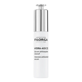 Frasco branco Filorga Hydra-AOX [5], sérum antioxidante intensivo de 30 ml, com doseador prateado.