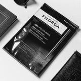 Filorga Time-Filler Mask, máscara facial preta em fibra e saqueta preta de 20 ml.